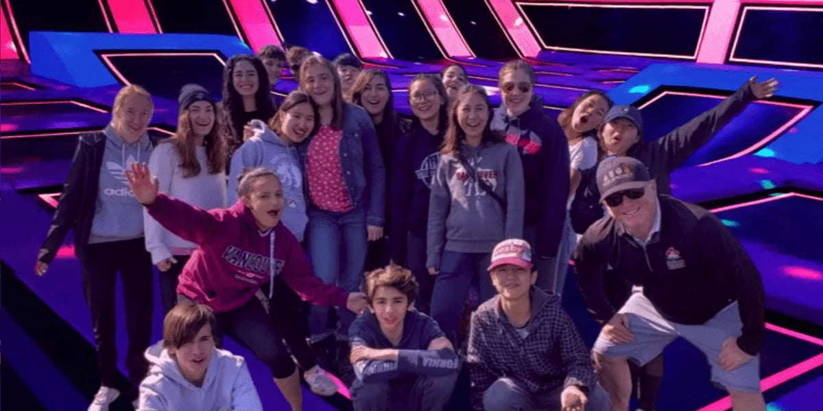 Colleagues having fun on trampolines during a corporate team-building event at AeroSports Windsor